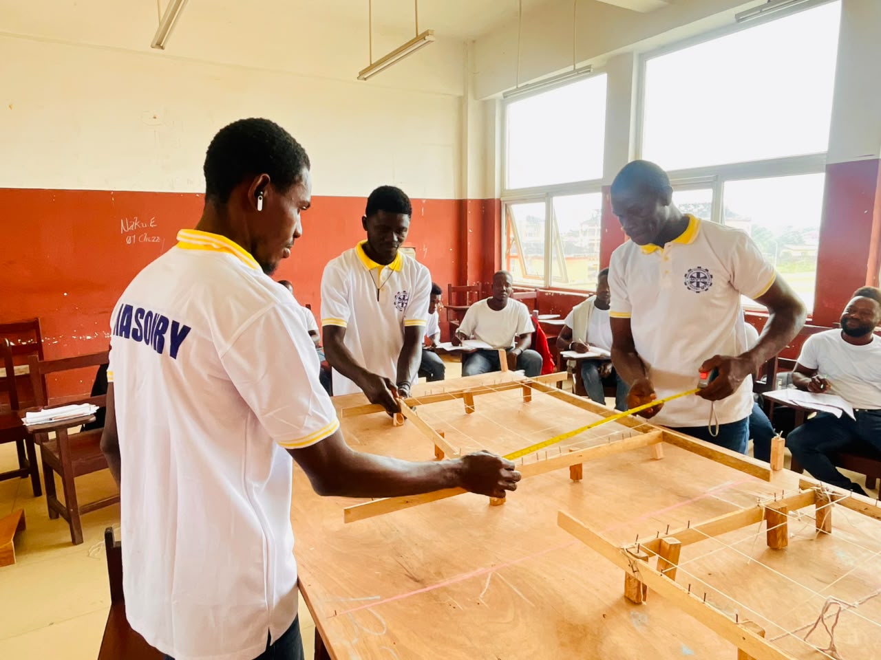 Student calculating measurements during a practical exercise